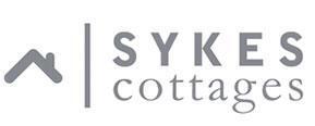 Sykes Cottages brand logo for reviews of travel and holiday experiences